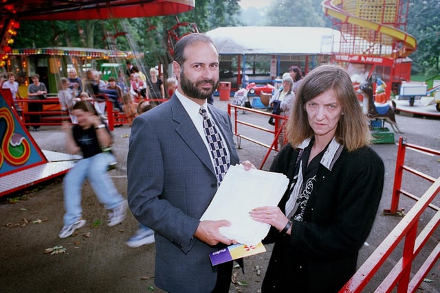 Fabian Hamilton receives a petition from Evelyn Miller whose family have run the fairground in Roundhay Park for around 50 years. Council chiefs were planning  to close the rides