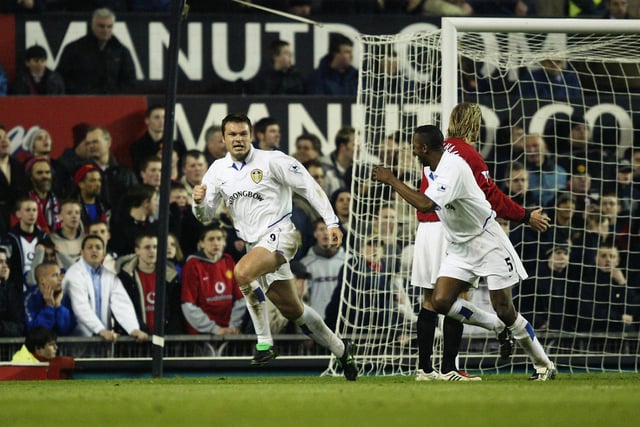 Mark Viduka celebrates after equalising for Leeds at Old Trafford. The Whites lost 2-1.