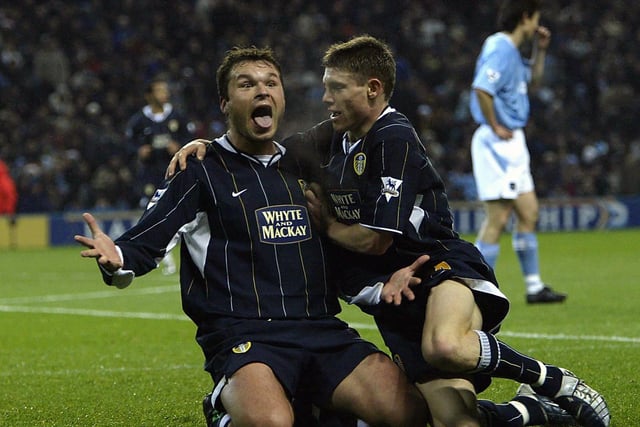 Mark Viduka celebrates scoring with James Milner after netting against Manchester City at City of Manchester Stadium. The game finished 1-1.