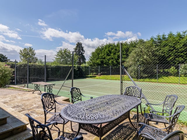 Residents have use of the tennis court in the communal garden