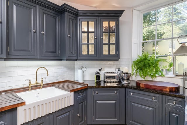 The spacious kitchen includes a modern Aga and granite worktops