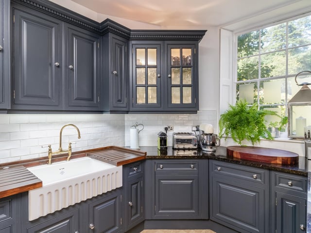 The spacious kitchen includes a modern Aga and granite worktops