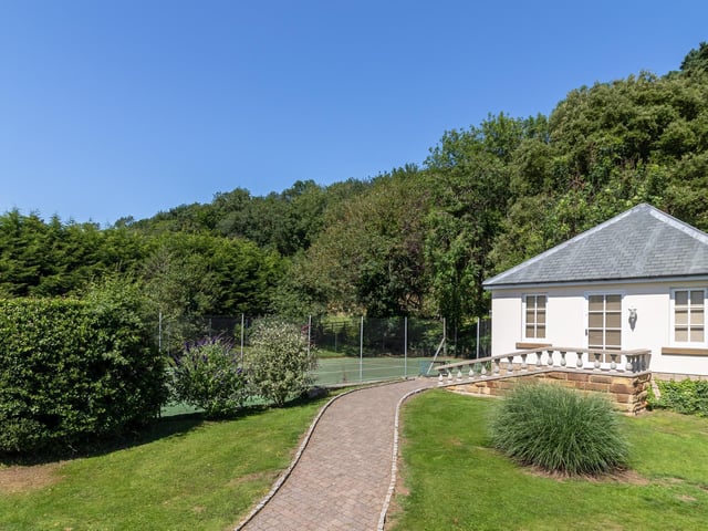 The tennis court in its secluded setting