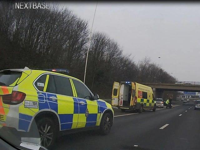 Displaying ‘report of obstruction’ messages automatically on electronic signs to warn oncoming drivers of a stopped vehicle ahead.