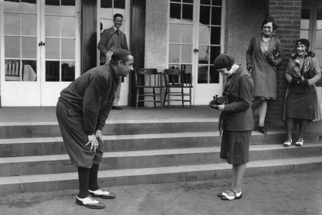 American captain Walter Hagen has his photograph taken by a young lady during the Ryder Cup at Moortown Golf Club
