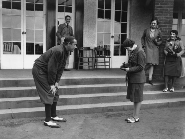 American captain Walter Hagen has his photograph taken by a young lady during the Ryder Cup at Moortown Golf Club