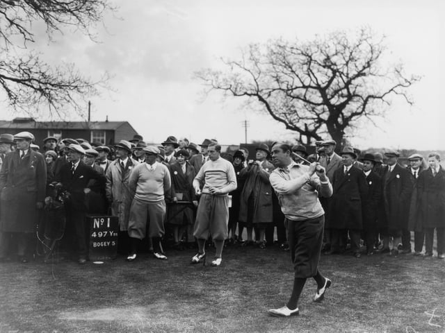 American golfer and captain of the USA Ryder Cup team, Walter Hagen tees off from the 1st.