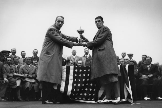 The British team won the competition and squared the series with the US having won on home soil two years earlier. George Duncan, British team captain, is presented with the cup by British businessman Samuel Ryder.