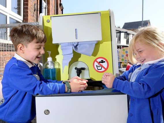 Hand-sanitising at Gladstone Road School.