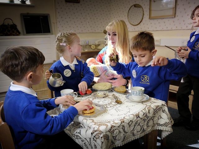 Miss Mackin holds a tea party for the new starters.