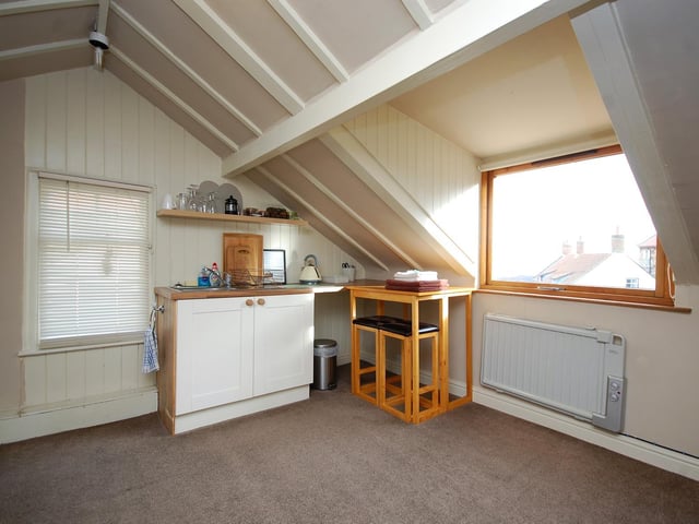 The penthouse suite offers a kitchenette and views of the sea