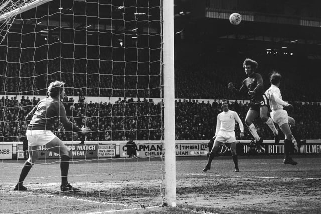 Gary Sprake watches as Peter Osgood beats Norman Hunter to head towards  goal from a free-kick during a match at Stamford Bridge in March 1971. The ball hit the crossbar.