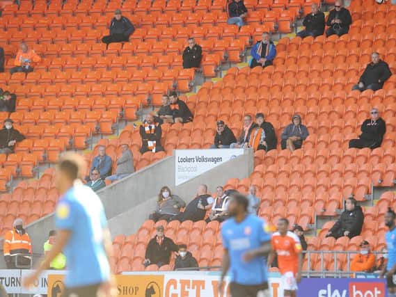 Blackpool fans sat socially distanced across Bloomfield Road's four stands