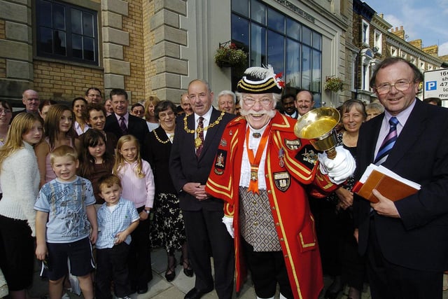 Mayor Herbert Tindall, Town Crier Alan Booth and Rev Graeme Parkins celebrate the opening of Scarborough’s Christian centre.