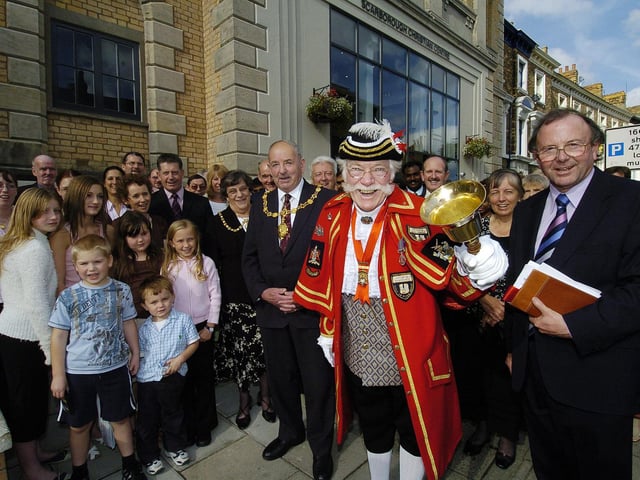 Mayor Herbert Tindall, Town Crier Alan Booth and Rev Graeme Parkins celebrate the opening of Scarborough’s Christian centre.