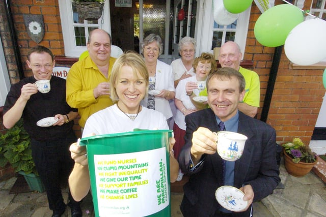 Macmillan coffee morning at Holbeck Hill (front l to r): Community Fundraiser Heidi Maxton and Scarborough MP Robert Goodwill.