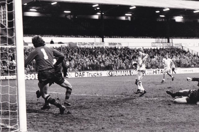 January 1983 and FA Cup third round replay action from Elland Road as Aidan Butterworth sidefoots the ball into the Arsenal net. The game finished 1-1.