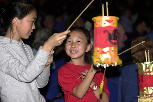 A couple of girls take part in the lantern procession at Leeds Town Hall for the Chinese Mid Autumn Festival.