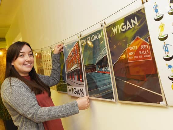 Louise Robson with Wigan inspired art on sale at the STEAM shop.