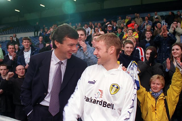 David Batty with manager David O'Leary, and hundreds of fans who turned up at Elland Road to welcome him back to Leeds United in 1998.