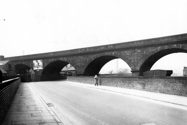 The viaduct on Viaduct Road in Armley in April 1956. The road passes under the L.N.E.R. railway track and alongside the River Aire and the Leeds/Liverpool canal.