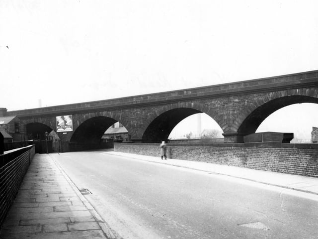 The viaduct on Viaduct Road in Armley in April 1956. The road passes under the L.N.E.R. railway track and alongside the River Aire and the Leeds/Liverpool canal.
