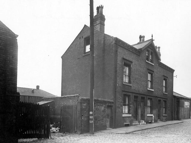 View of gates of the yard at Thomas West Ltd, Cooper, of Brandon Street in September 1950.