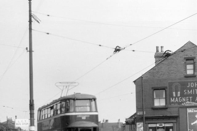 View of tram no 506 on route 18 to Cross Gates showing pole with temporary clamp in July 1956.