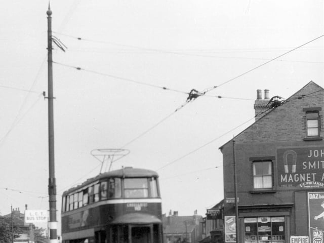 View of tram no 506 on route 18 to Cross Gates showing pole with temporary clamp in July 1956.