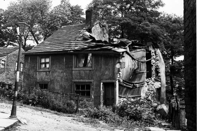 July 1950. Cottages in Tower Lane, Upper Armley. Number 68 is badly damaged.