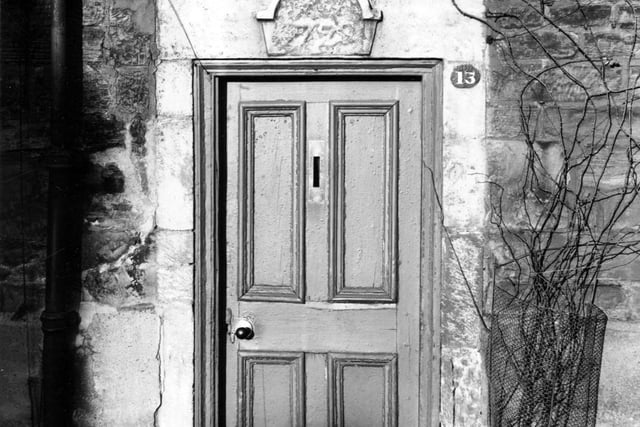 Far Fold in December 1955. Doorway is set in a stone wall with stone surround with plaque above the door with a date - possibly 1799.