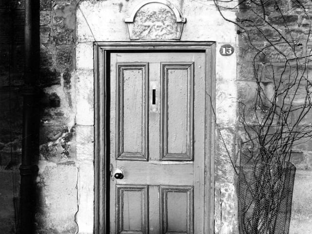 Far Fold in December 1955. Doorway is set in a stone wall with stone surround with plaque above the door with a date - possibly 1799.