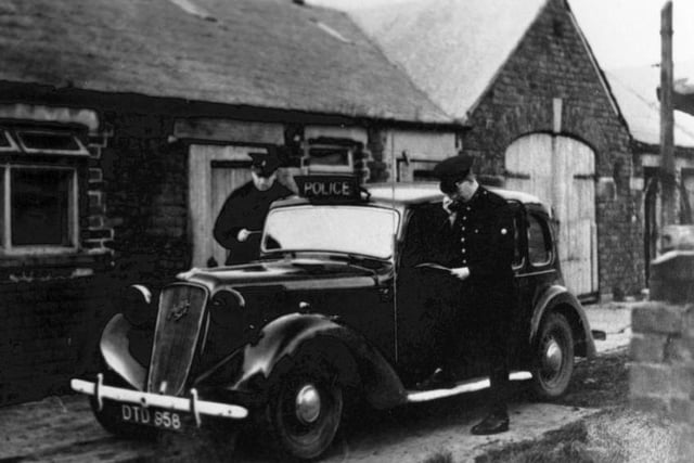 An Austin 16 police patrol car in Kirkham in 1944 with one of the PCs using a radio. It was described on the picture as a replay of the Freckleton Air Disaster