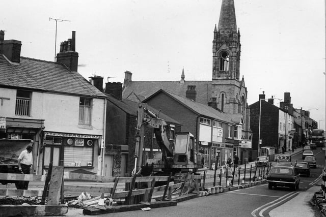 Work in progress in Poulton Street in 1981 on the new Orders Lane culvert. Greater changes were yet to come when the houses to the left of the United Reformed Church were demolished to provide acces to what is now Morrison's supermarket