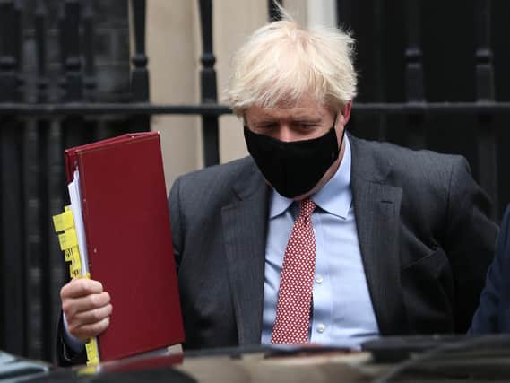 Boris Johnson leaves 10 Downing Street to attend Prime Minister's Questions on September 30