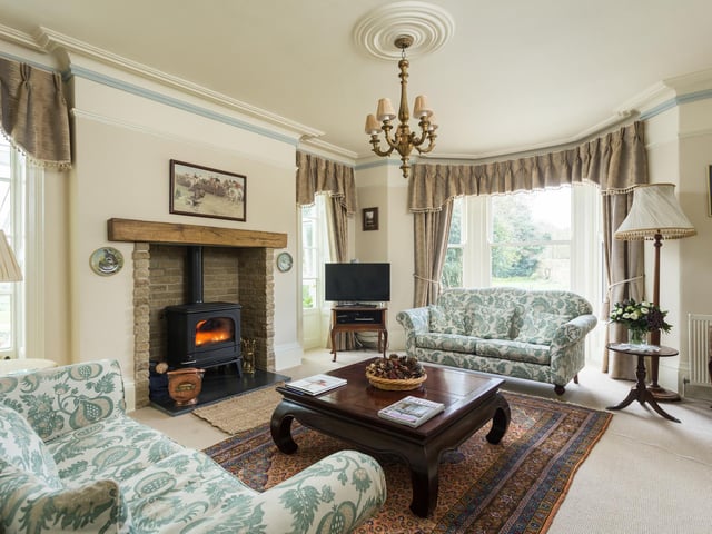 The fire is the focal point of the sitting room
