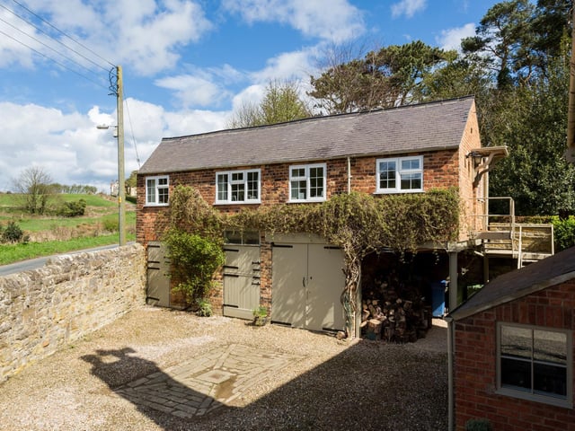 The coach house contains a three bedroom apartment
