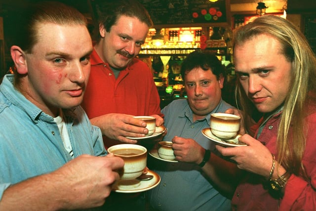 Ian Bradley, Darren Jewison, Brian Booth and Richard Foster, sober up with a cup of coffee after each having drunk in all of Leeds 615 pubs.