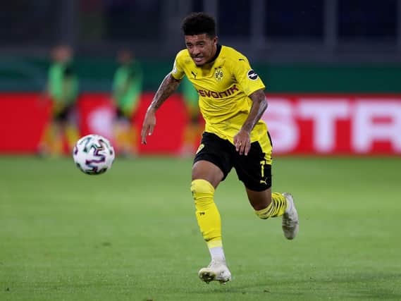 Jadon Sancho of Dortmund runs with the ball during the DFB Cup first round match between MSV Duisburg and Borussia Dortmund at Schauinsland-Reisen-Arena on September 14, 2020 in Duisburg, Germany. (Photo by Lars Baron/Getty Images)