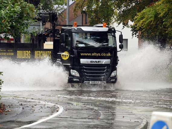 Lorries struggle with the amount of water on the roads in Buckshaw Village