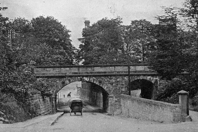 The bridge was constructed in 1838 to take the then Midland Railway over the turnpike road. The turning into Station Lane can just be seen on the left.