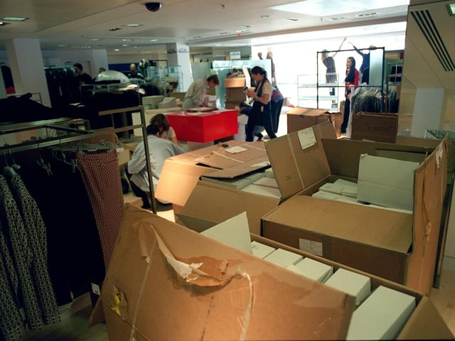 Boxes of stock needing to be put on display ahead of the opening.