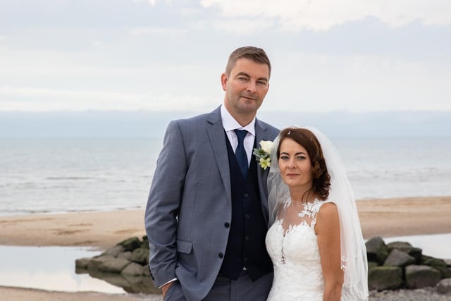 The seaside location was perfect for their wedding photos
