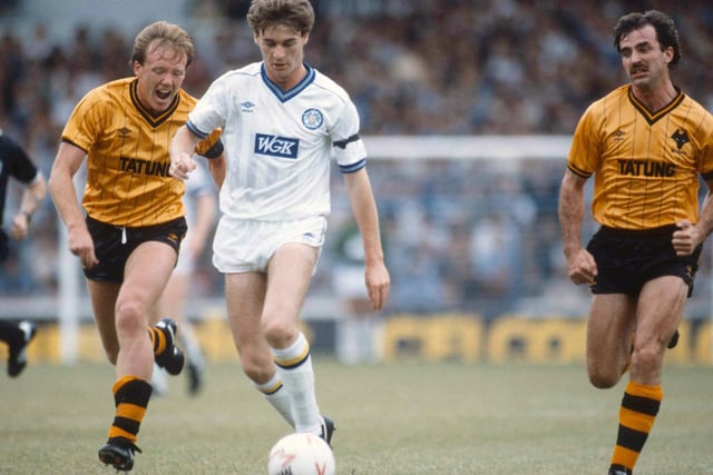 John Sheridan on the march against Wolves at Elland Road in September 1984. The Whites won 3-2 thanks to a brace from Tommy Wright and a goal from Peter Lorimer.