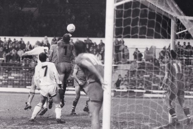 More FA Cup third round action from Elland Road as Everton's Neville Southall punches clear from a Leeds United corner.
