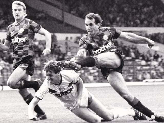 Manchester City's Imre Varadi gets in his shot despite appearing to crack Jack Ashurst on the head during the clash at Elland Road in September 1987. The Whites won the game 2-0