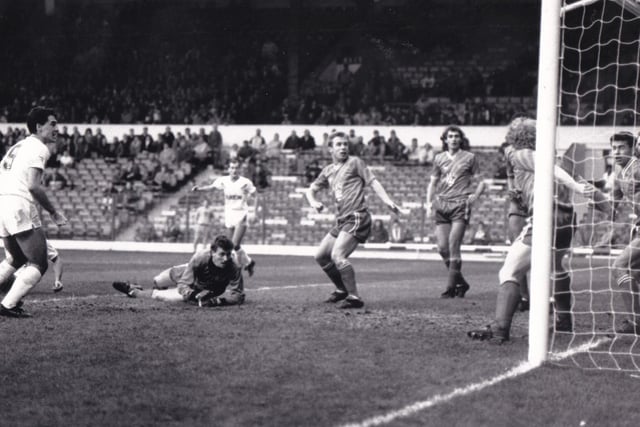 Bobby Davison - on the ground behind Bob Taylor - scored his first goal for Leeds United after shooting through a packed goalmouth for United's second goal in the 4-2 against Swindon Town.