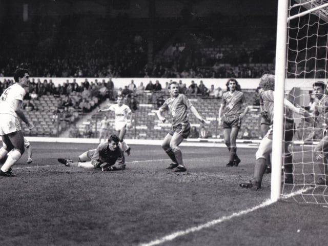 Bobby Davison - on the ground behind Bob Taylor - scored his first goal for Leeds United after shooting through a packed goalmouth for United's second goal in the 4-2 against Swindon Town.