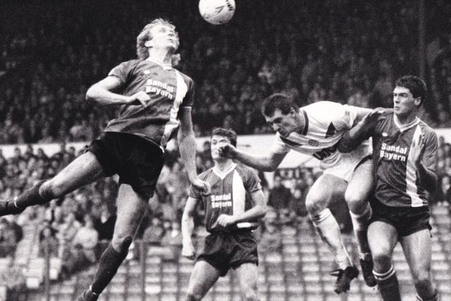 Peter Swan rises above the Barnsley defence during the clash at Elland Road in January 1988. The Reds won 2-0.