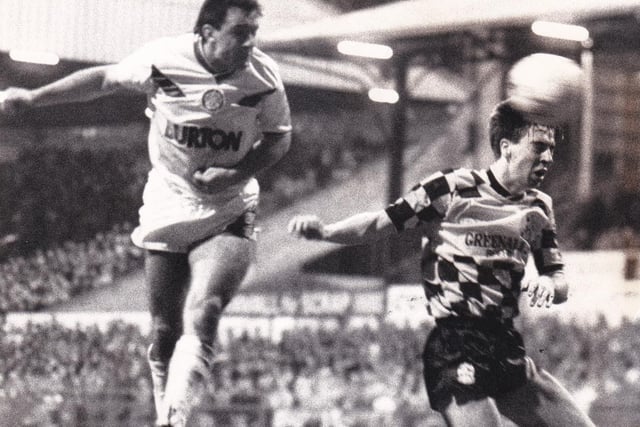Bobby Davison leaps to head home Leeds United's third goal against Huddersfield Town at Elland Road in December 1987.
